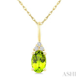 1/50 Ctw Oval Cut 6X4 MM Peridot and Round Cut Diamond Semi-Precious Pendant With Chain in 10K Yellow Gold