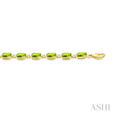 6X4 MM Oval Cut Peridot and 1/6 Ctw Round Cut Diamond Semi-Precious Tennis Bracelet in 10K Yellow Gold
